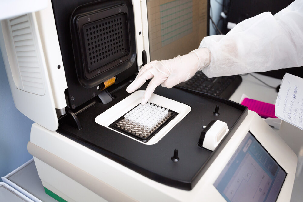 Placing DNA tests in the machine for analysis