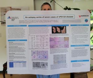 Professor Ruth Walker with the poster resulted from the scientific paper