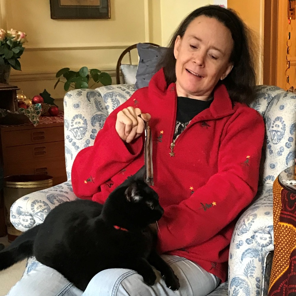 Alex Irvine and Coco, the black cat