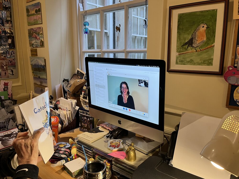 Alex Irvine sharing the newly arrived copy of Cataclysmic Limericks in the session with her speech therapist, Dr Elina Tripoliti 