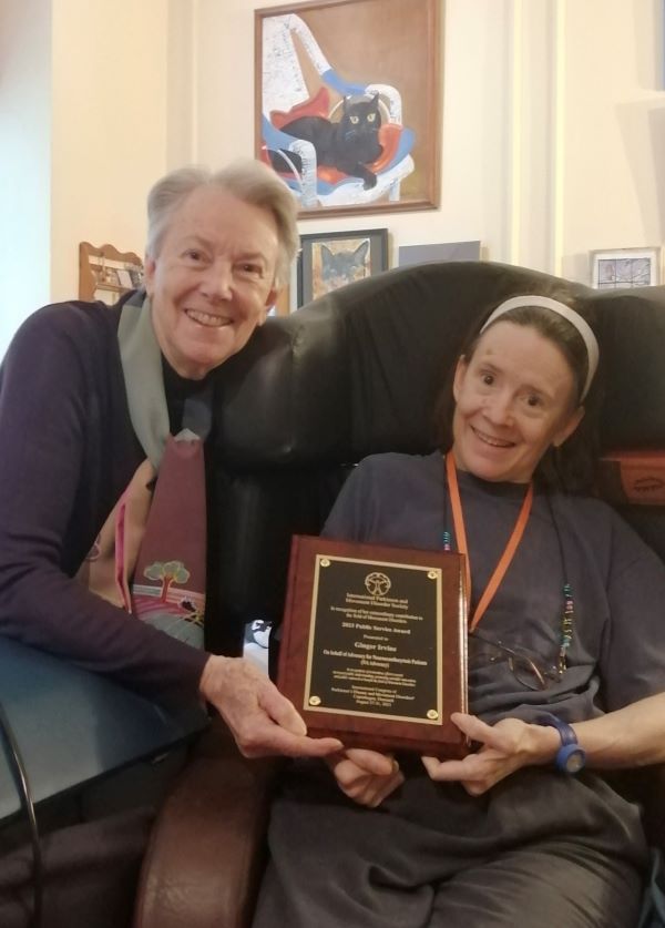 It took a while to arrive, but Alex Irvine of London proudly shows off her mother's service award from the International Parkinsons and Movement Disorder Society.