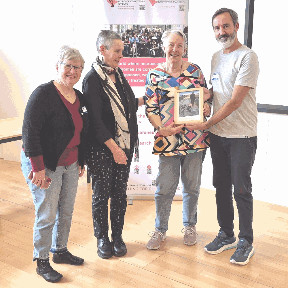 Mauro Corage (director of the theatre play presented) awarding a memory, the poster of the show to Ginger Irvine, Professor Ruth Walker and Joy Willard-Williford
